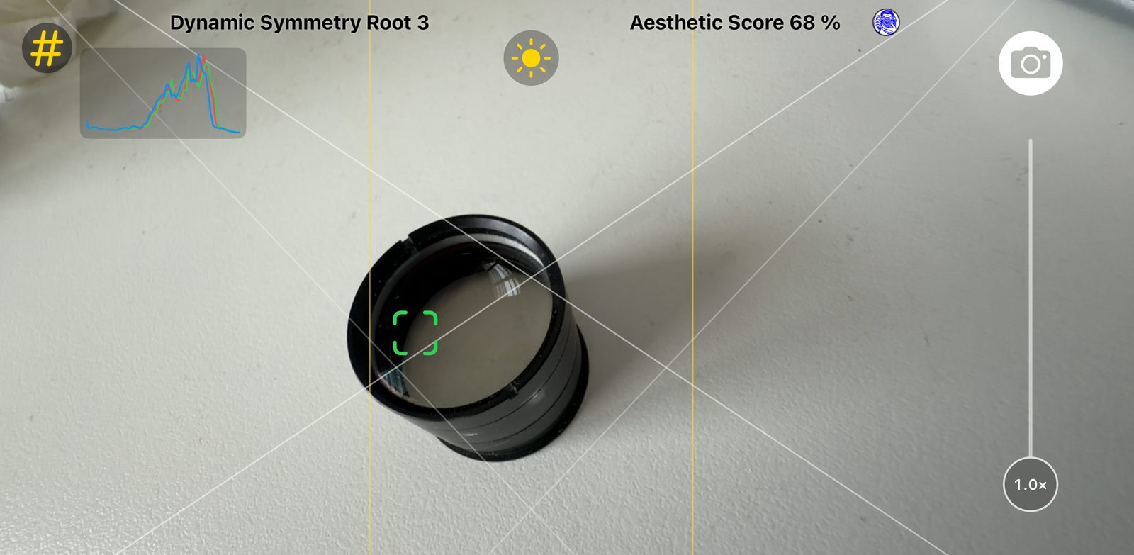 Framing Coach viewfinder with a composition guide, tap-to-focus box, live histogram and aesthetic score